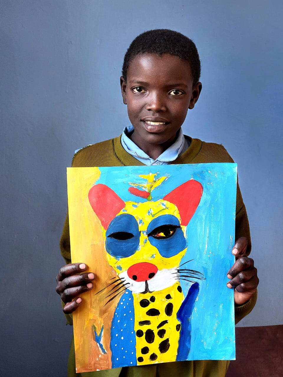 Salome Jakob holding Wildcat artwork