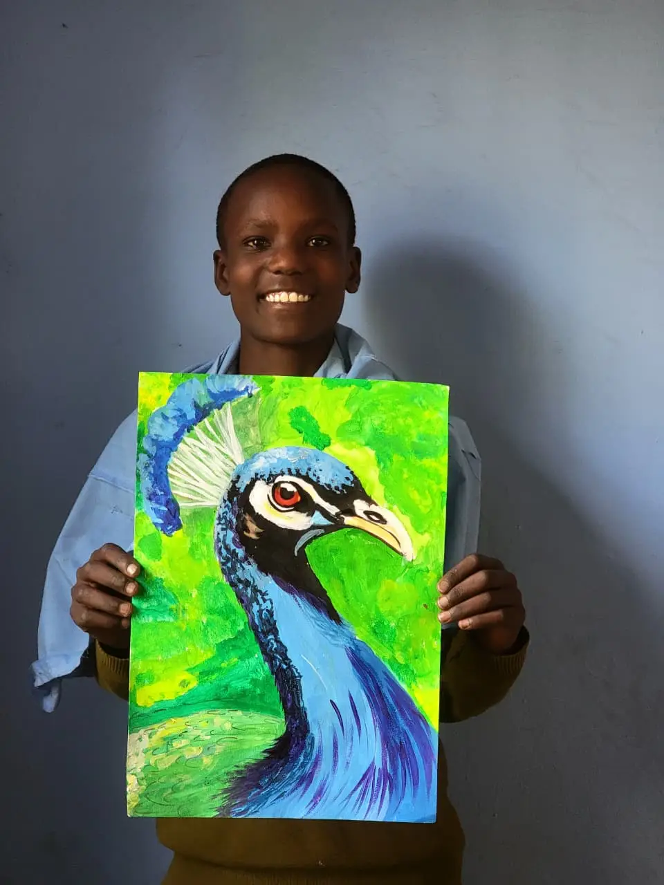 Melekizedeki Raphael holding his original peacock painting